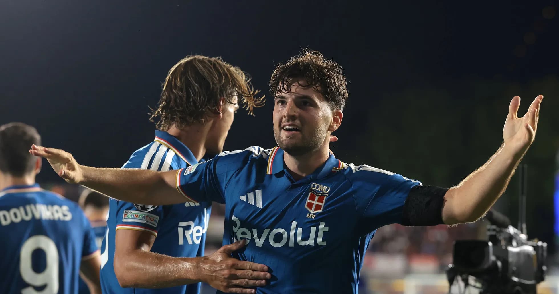 Player celebrating a goal with teammates on field Player celebrating a goal with teammates on field
