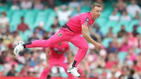 Bowler delivering ball during cricket match Bowler delivering ball during cricket match