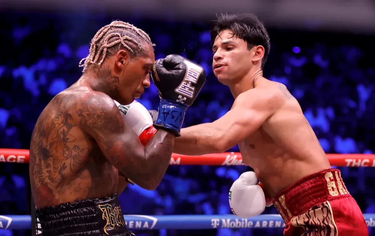 Two boxers exchanging punches in the ring Two boxers exchanging punches in the ring