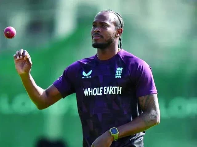 Cricketer holding a ball during practice session Cricketer holding a ball during practice session
