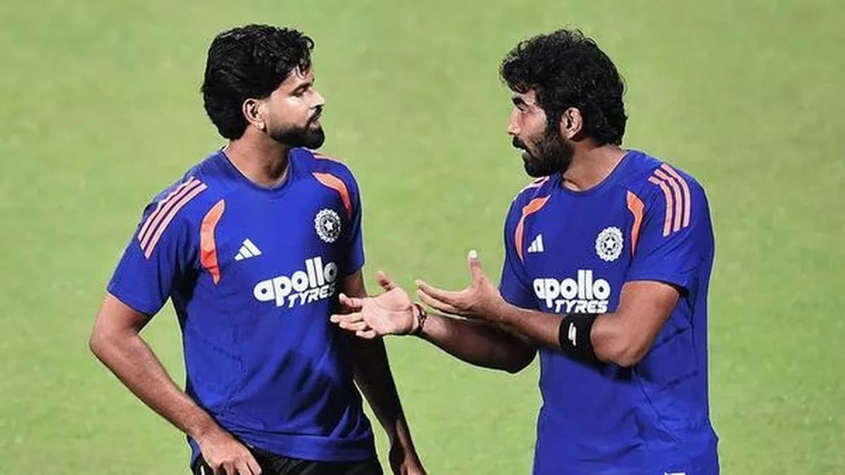 Two players discussing during cricket practice session Two players discussing during cricket practice session