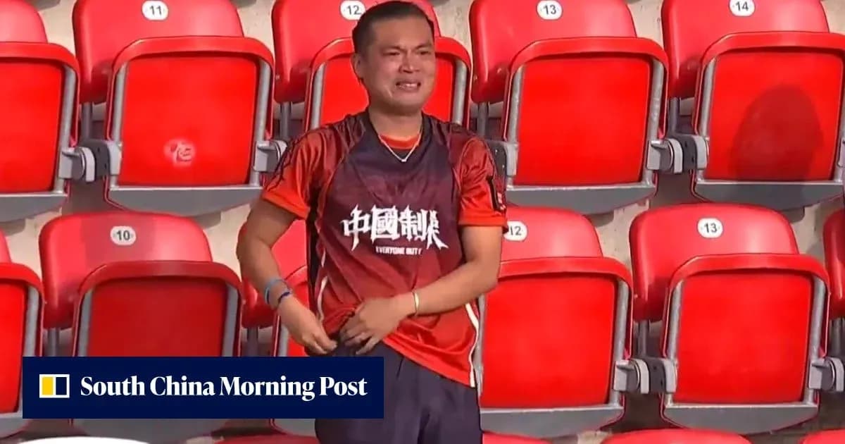 Fan wearing a jersey in empty stadium seats Fan wearing a jersey in empty stadium seats