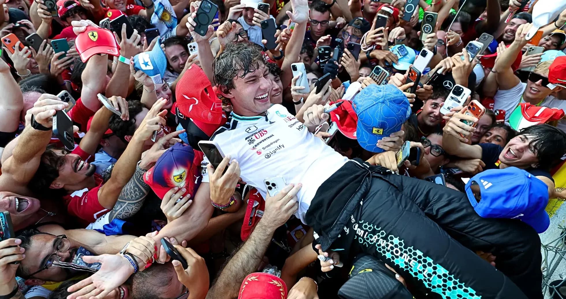 Driver celebrated by fans after race victory Driver celebrated by fans after race victory