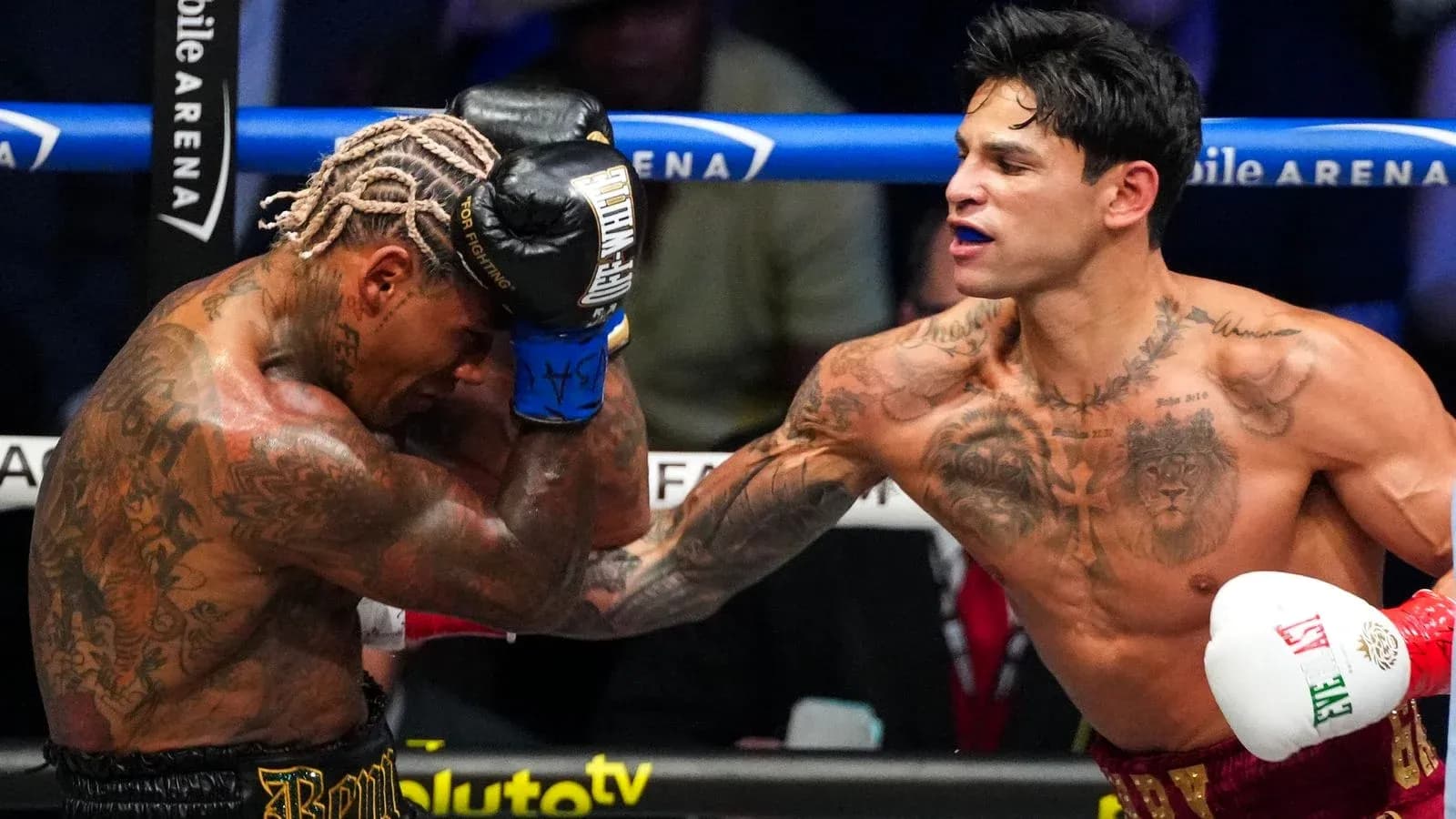 Boxers exchanging punches in the ring during match Boxers exchanging punches in the ring during match