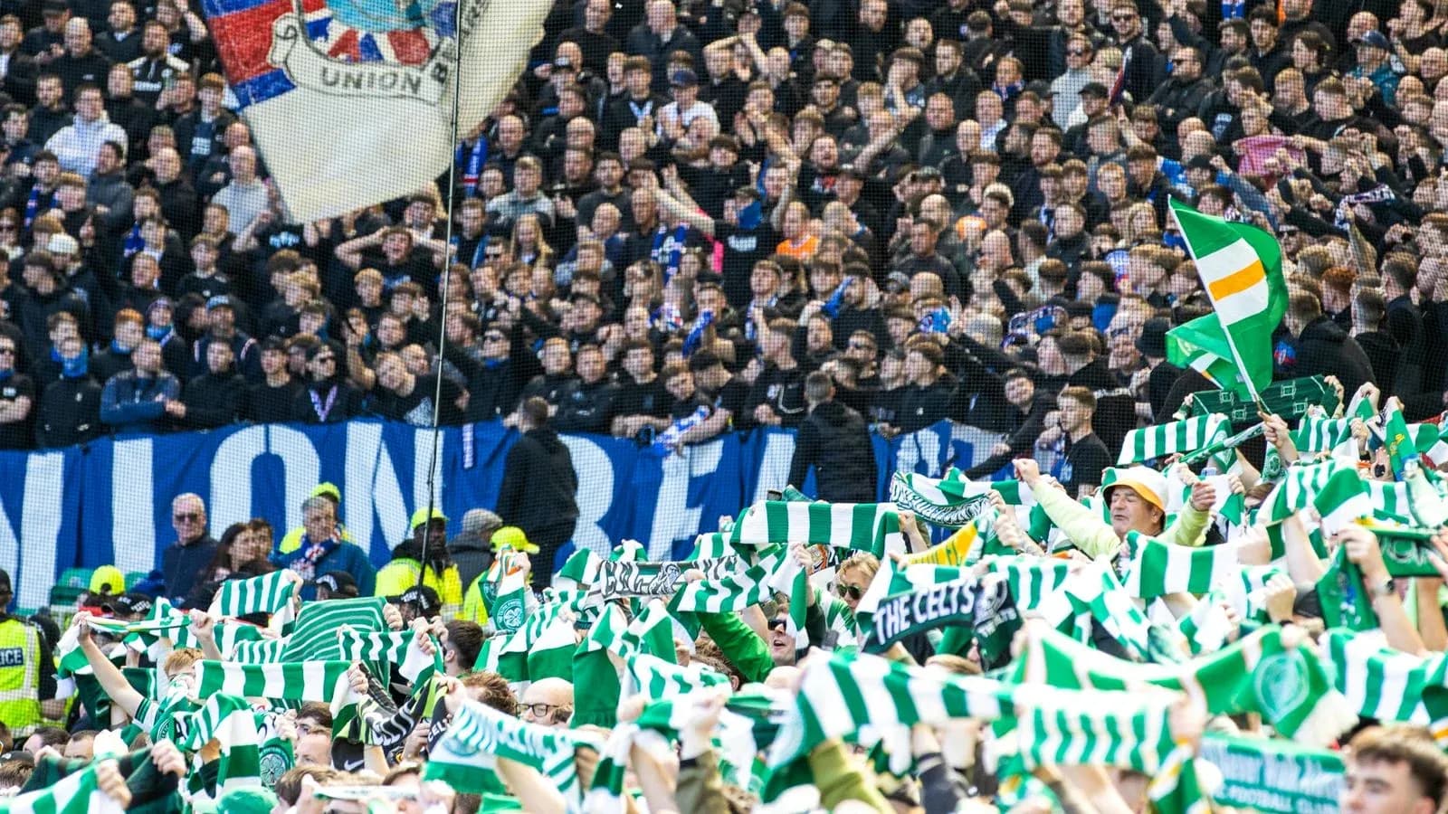 Fans waving scarves in a crowded stadium Fans waving scarves in a crowded stadium