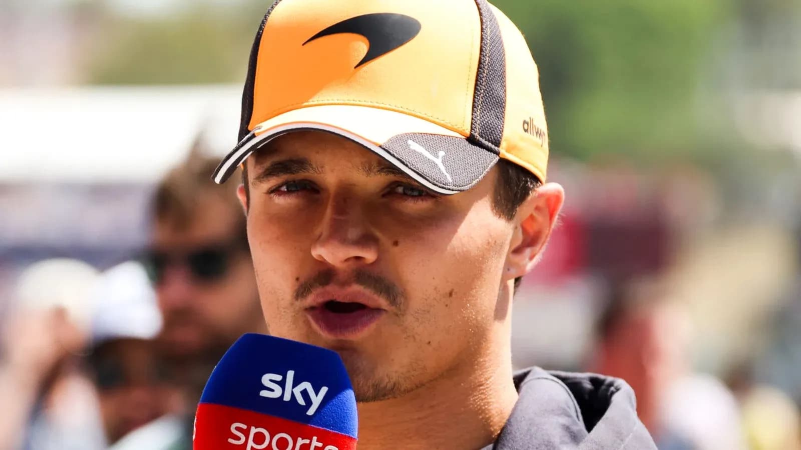 Driver speaking into microphone during interview Driver speaking into microphone during interview