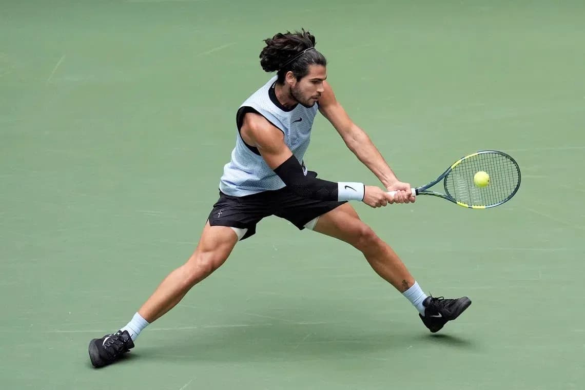 Player executing a forehand stroke on court Player executing a forehand stroke on court