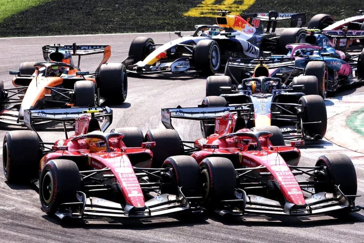 Several Formula 1 cars racing closely on track Several Formula 1 cars racing closely on track