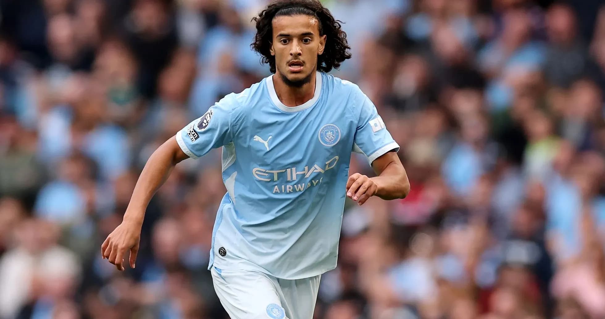 Player running during Manchester City match Player running during Manchester City match
