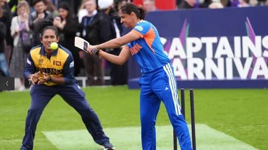 Player batting while another prepares to catch Player batting while another prepares to catch