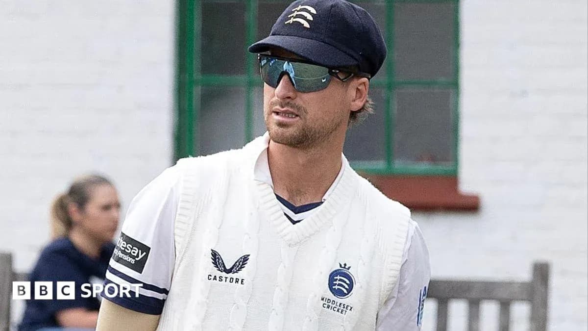 Cricketer wearing Middlesex kit and sunglasses Cricketer wearing Middlesex kit and sunglasses