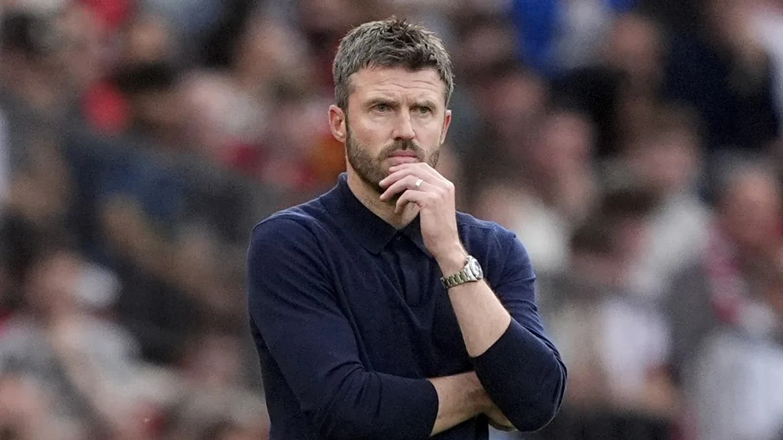 Manager observing the match with thoughtful expression Manager observing the match with thoughtful expression