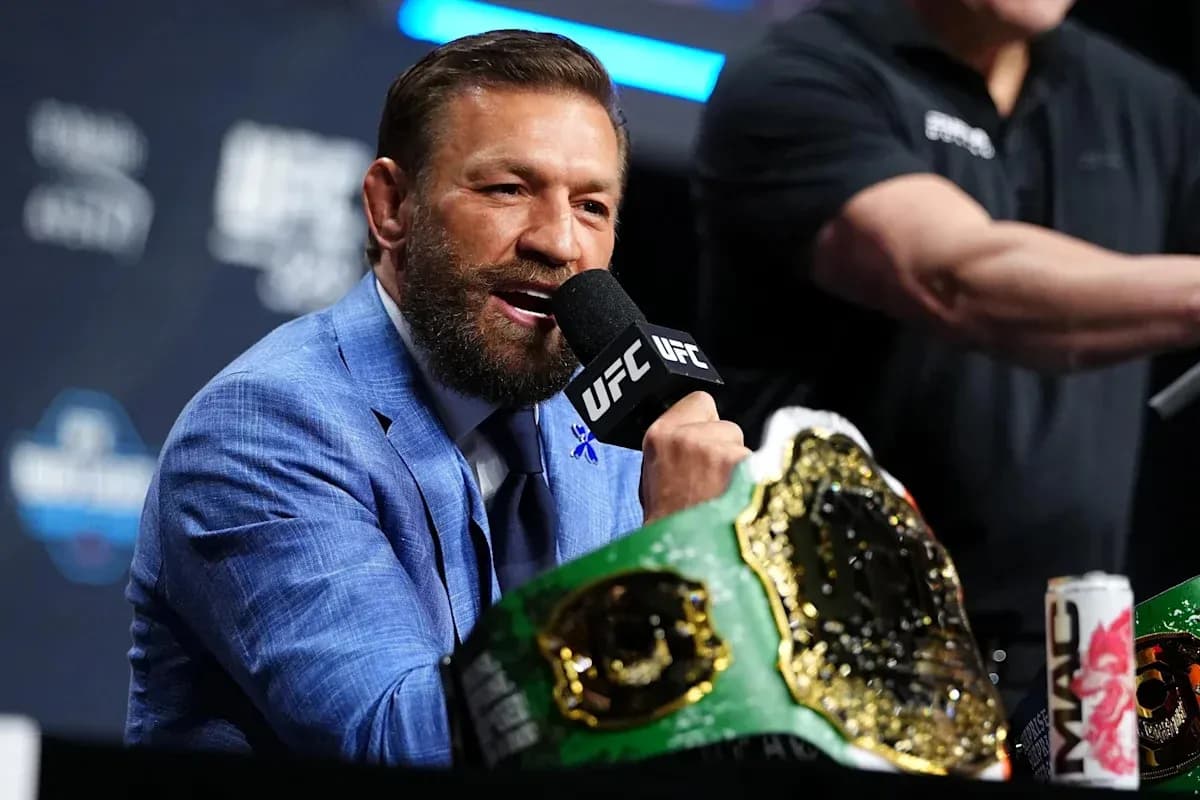 Fighter speaking at press conference with championship belt Fighter speaking at press conference with championship belt