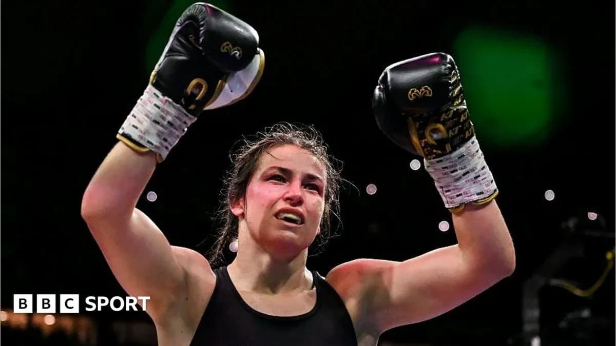 Boxer celebrating victory with raised fists in gloves Boxer celebrating victory with raised fists in gloves