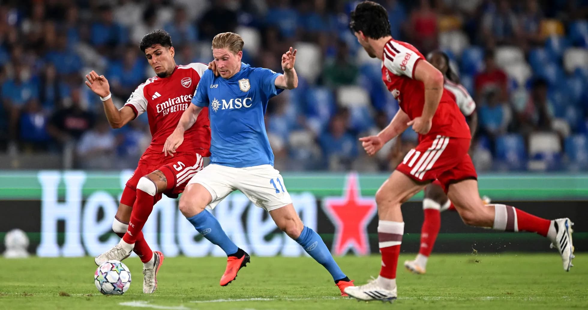 Players contesting for the ball during a match Players contesting for the ball during a match