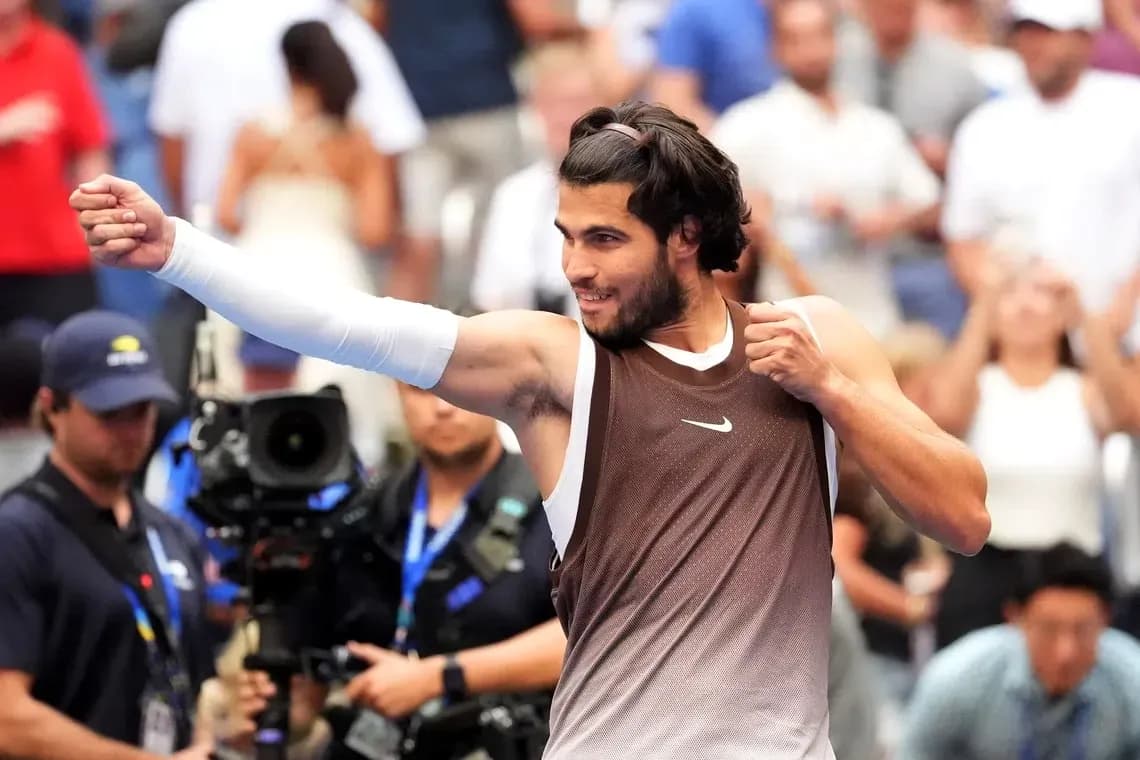 Tennis player celebrating after winning a match Tennis player celebrating after winning a match