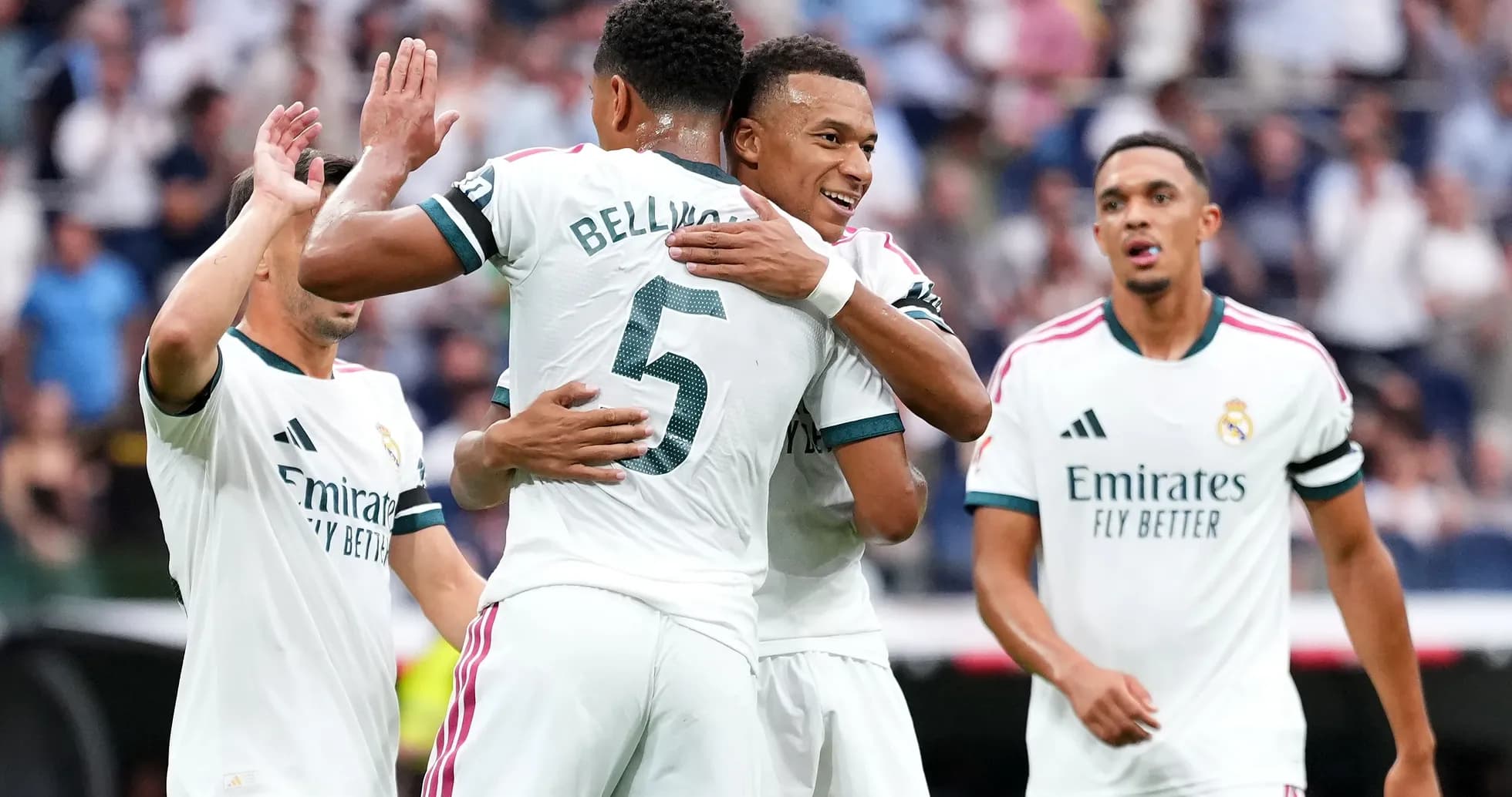 Players celebrating a goal during a match Players celebrating a goal during a match
