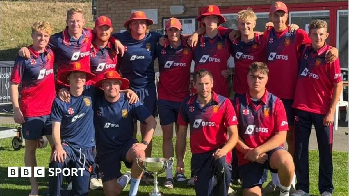 Cricket team posing with trophy after victory Cricket team posing with trophy after victory
