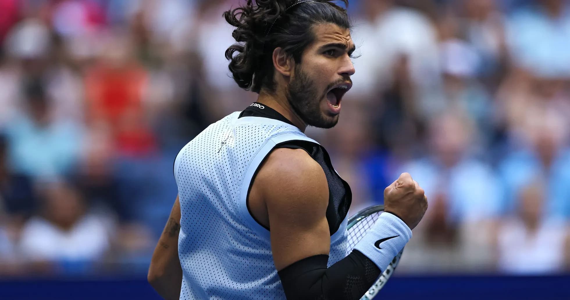 Tennis player celebrating during a match Tennis player celebrating during a match