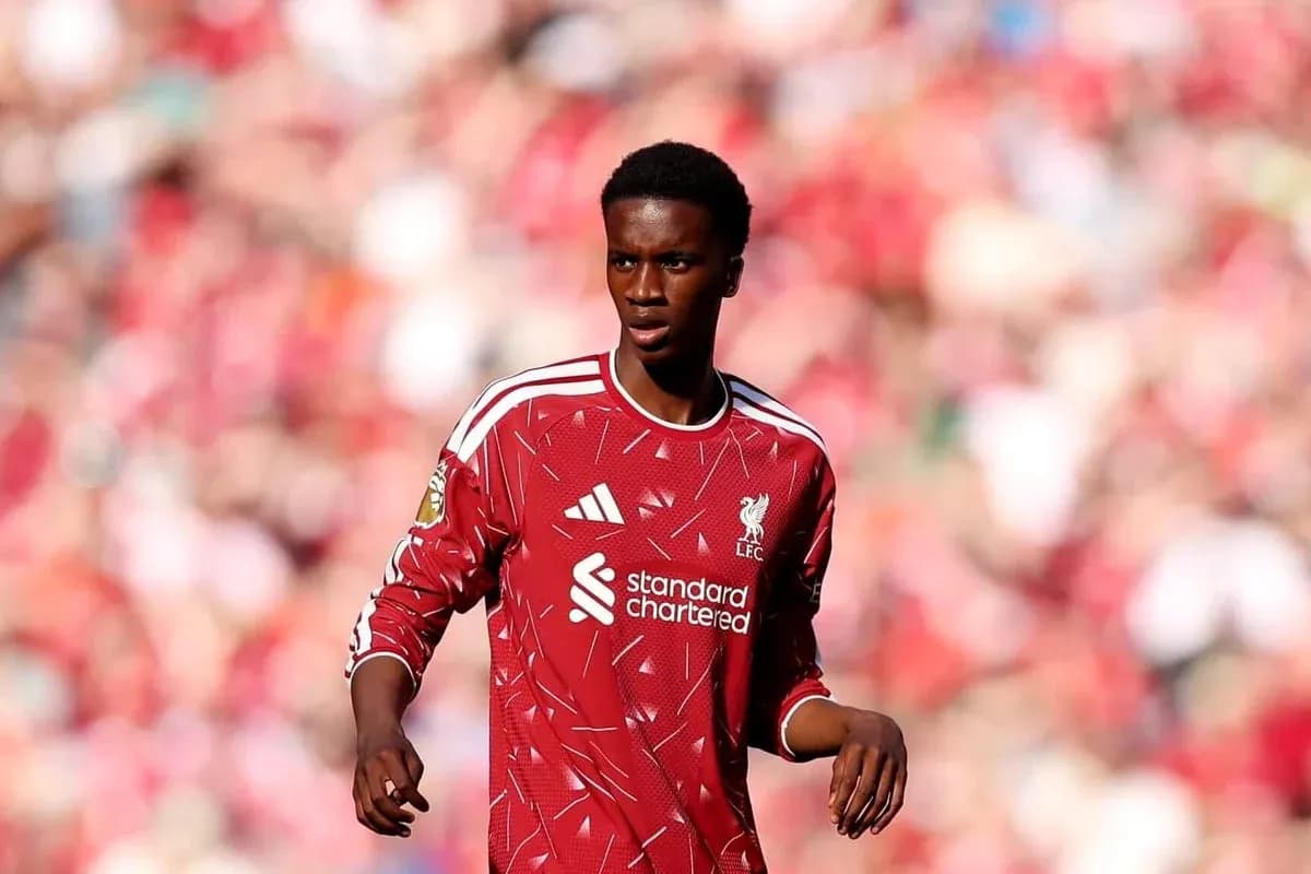Player in red Liverpool jersey on the pitch Player in red Liverpool jersey on the pitch