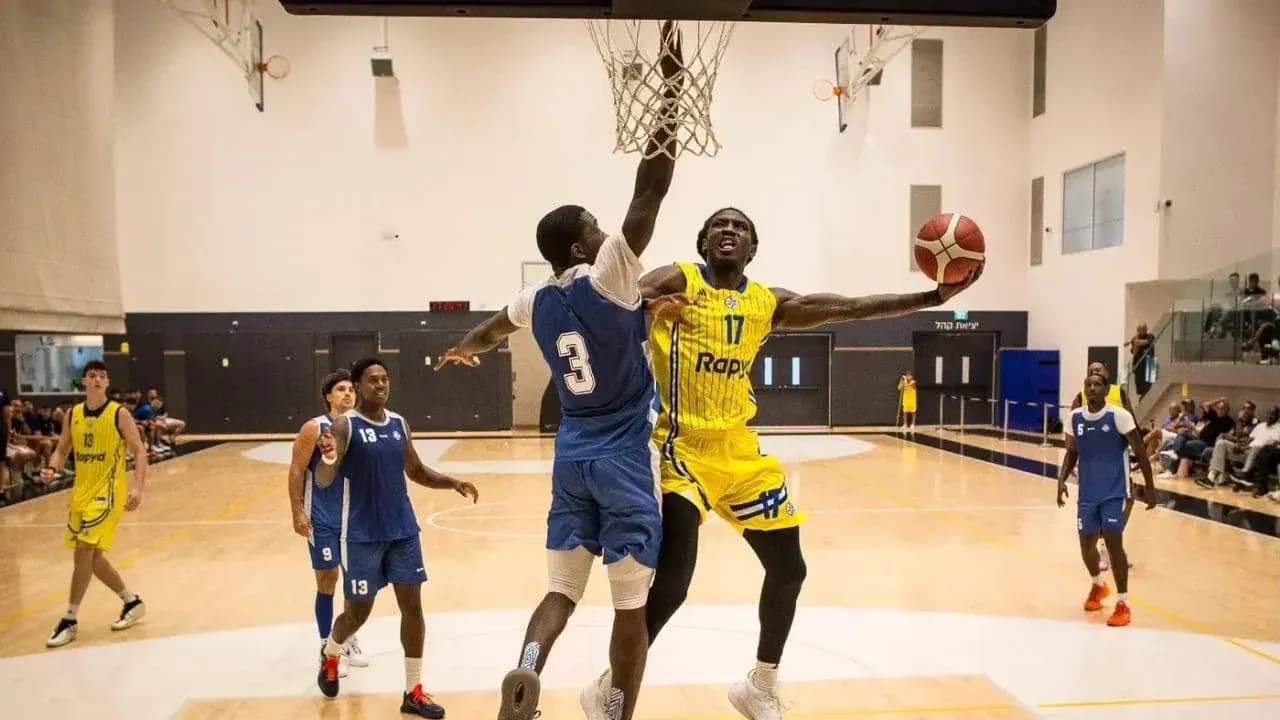 Player dunking the basketball during a game Player dunking the basketball during a game