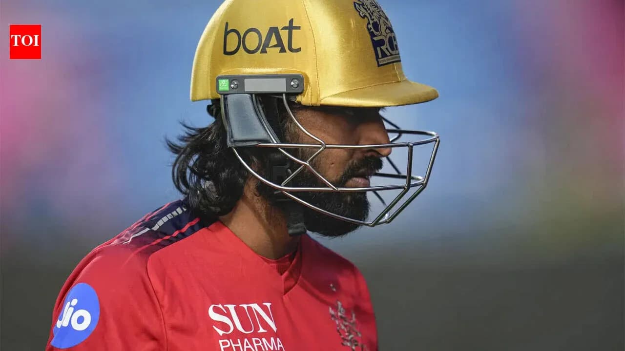Cricketer wearing a helmet during match preparation Cricketer wearing a helmet during match preparation