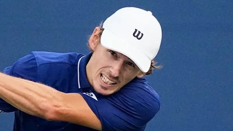 Tennis player hitting a forehand shot during match Tennis player hitting a forehand shot during match