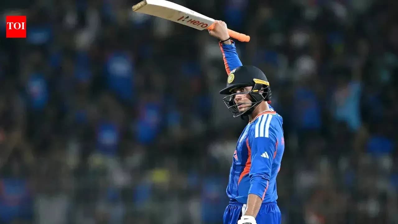 Batsman celebrating with raised bat during match Batsman celebrating with raised bat during match