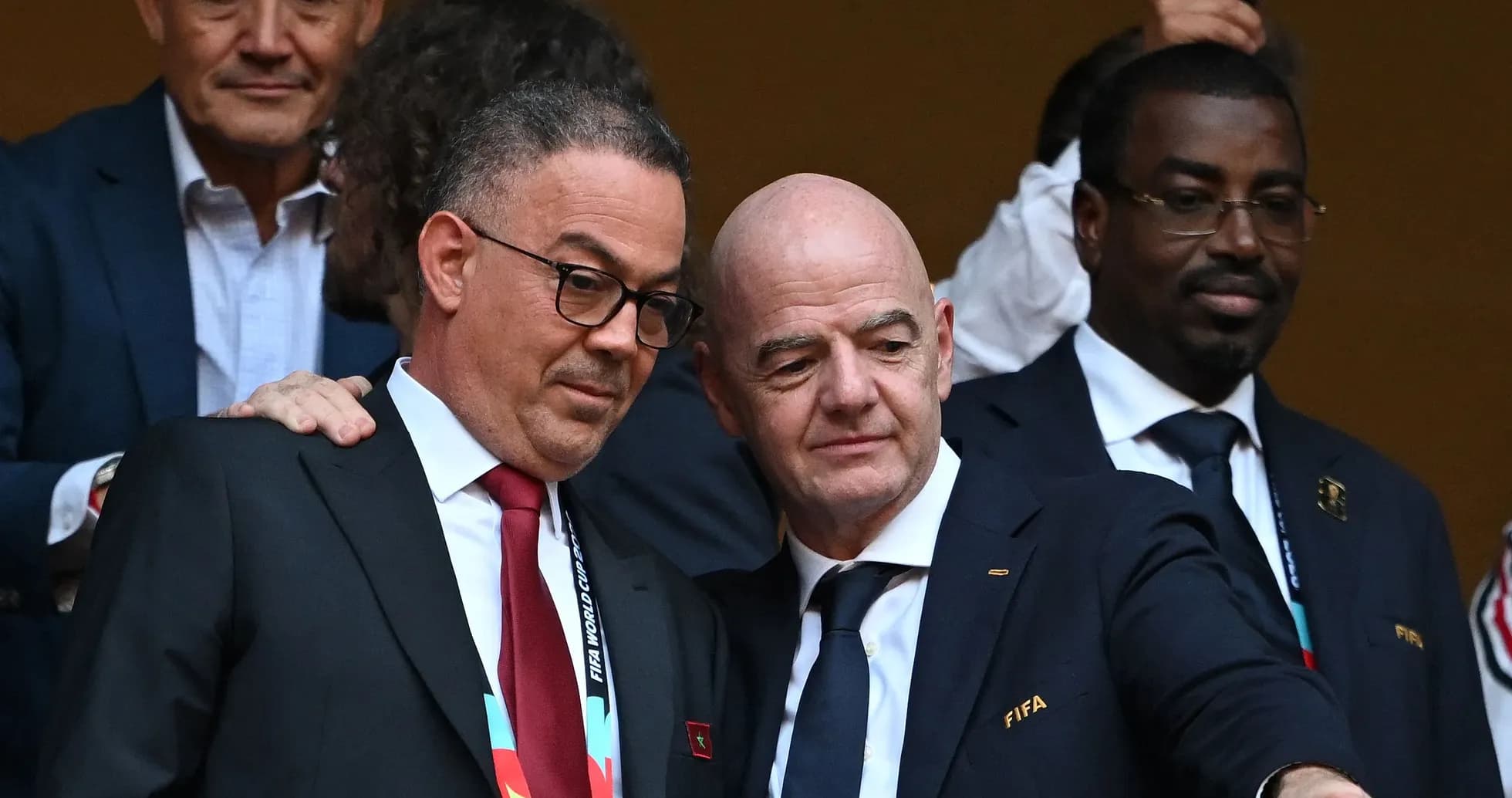 Two officials discussing at a football event Two officials discussing at a football event