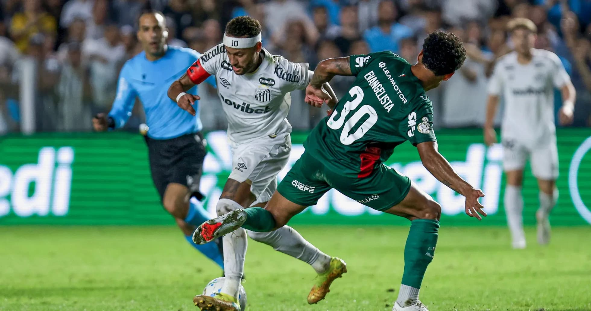Player dribbling past opponent during football match Player dribbling past opponent during football match