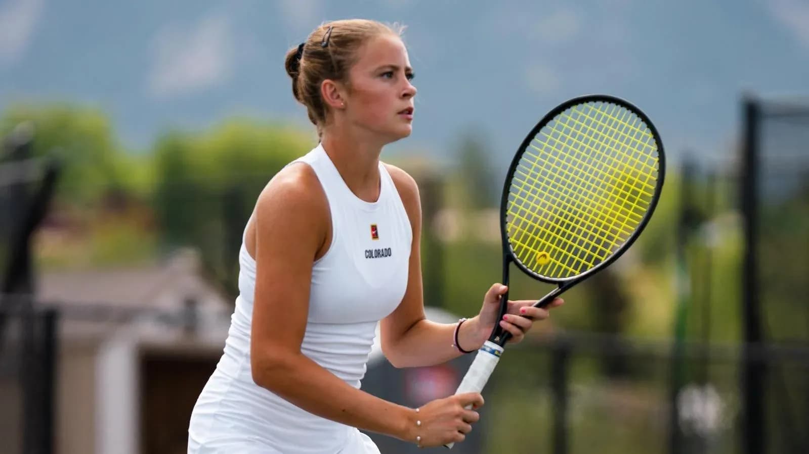 Tennis player preparing to serve on court Tennis player preparing to serve on court