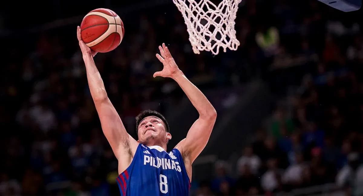 Player shooting the basketball towards the hoop Player shooting the basketball towards the hoop