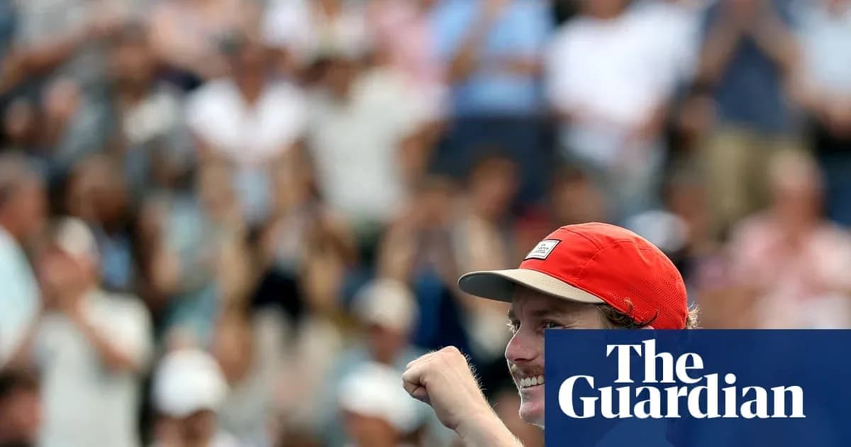 Player celebrating victory with raised fist in crowd Player celebrating victory with raised fist in crowd