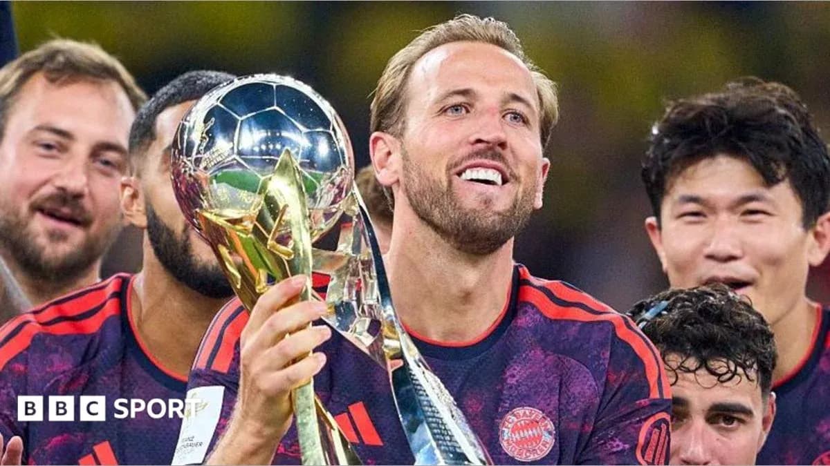 Player celebrating with trophy surrounded by teammates Player celebrating with trophy surrounded by teammates