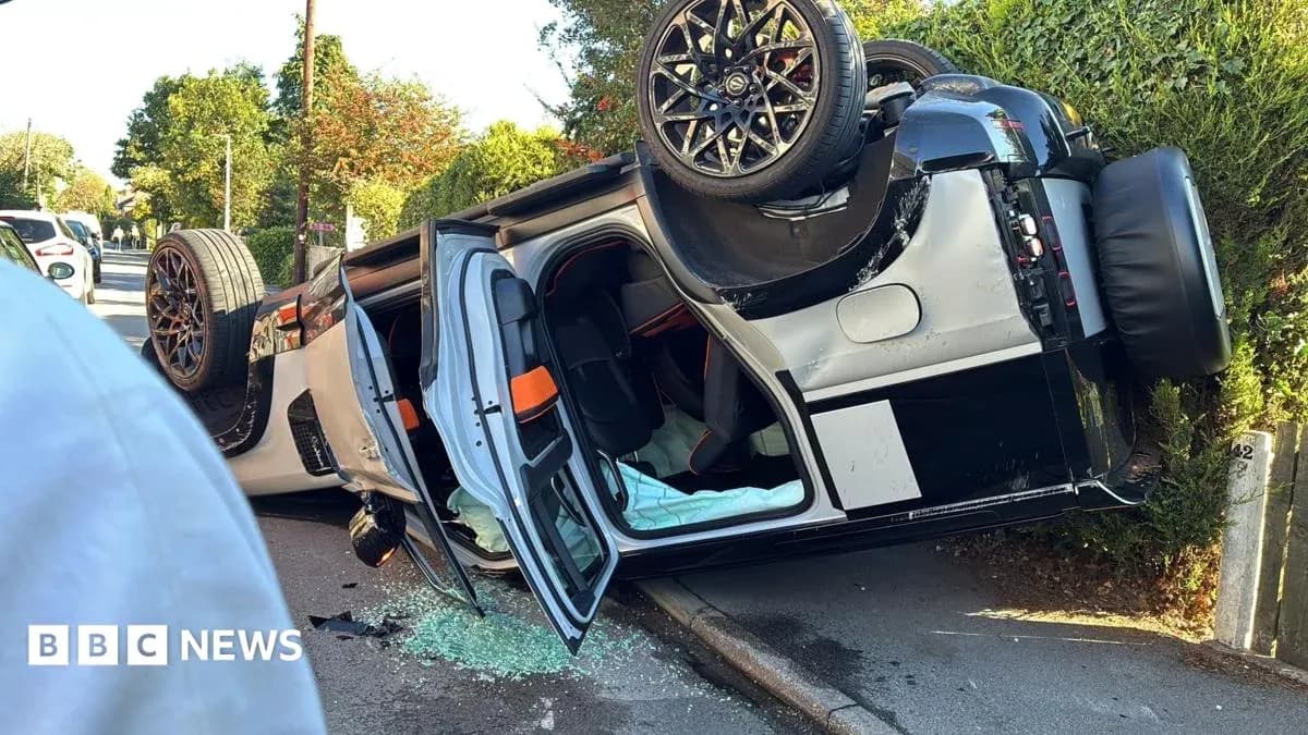 Upside-down car with shattered glass on road Upside-down car with shattered glass on road