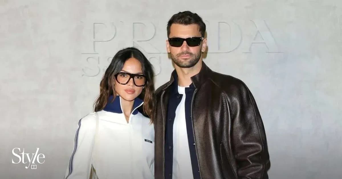 Couple posing in stylish outfits at event Couple posing in stylish outfits at event
