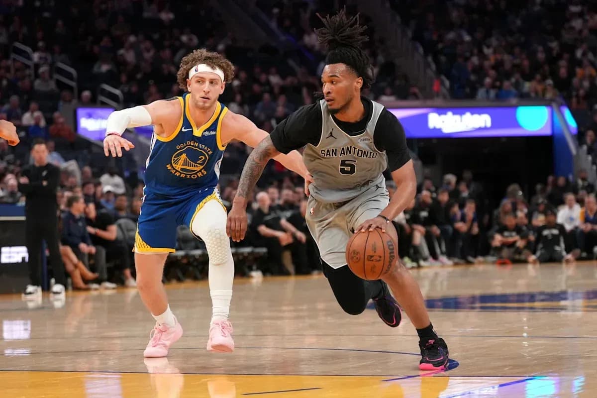 San Antonio player dribbling past Golden State defender San Antonio player dribbling past Golden State defender