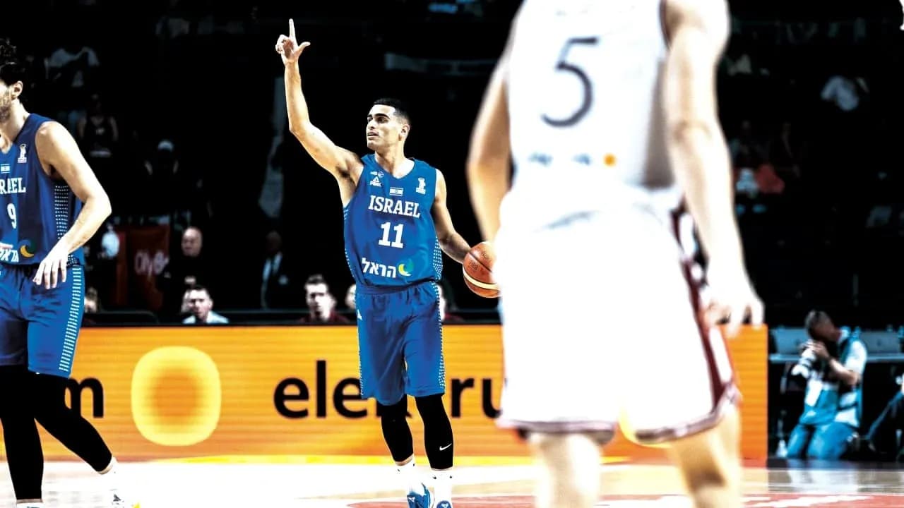 Player 11 from Israel signaling during basketball game Player 11 from Israel signaling during basketball game