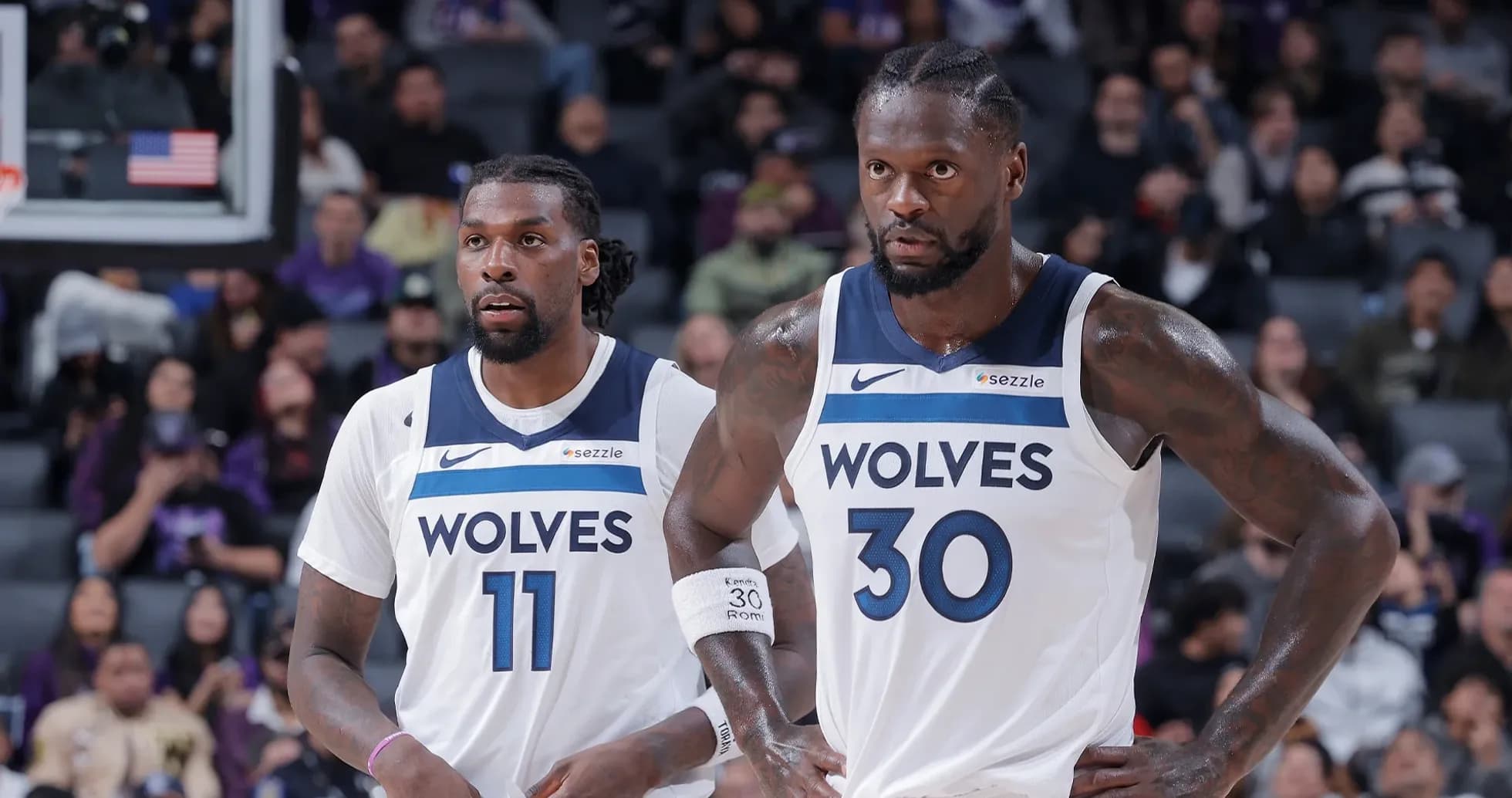 Two players in Minnesota Timberwolves jerseys on court Two players in Minnesota Timberwolves jerseys on court