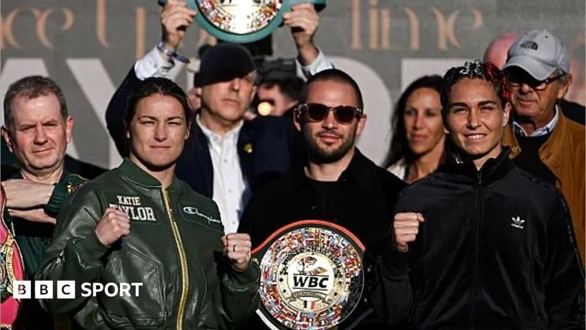 Katie Taylor and opponent posing with WBC belts Katie Taylor and opponent posing with WBC belts