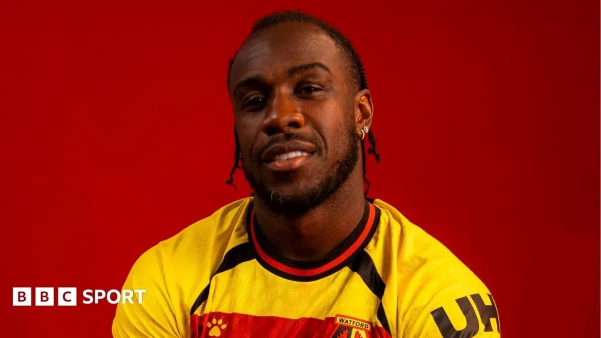 Player posing in Watford FC jersey against red background Player posing in Watford FC jersey against red background