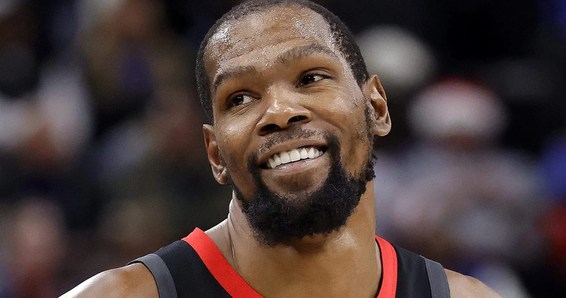 Kevin Durant smiling during a basketball game Kevin Durant smiling during a basketball game