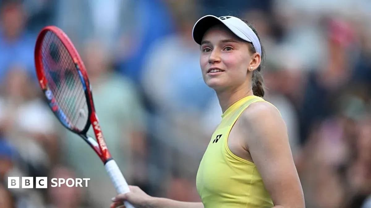 Tennis player smiling while holding racket on court Tennis player smiling while holding racket on court