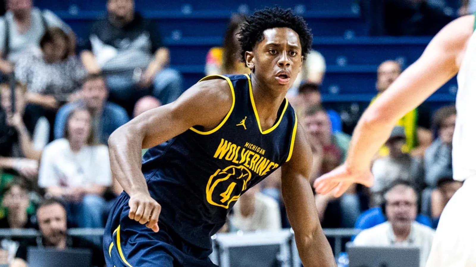 Player dribbling ball during Michigan Wolverines game Player dribbling ball during Michigan Wolverines game