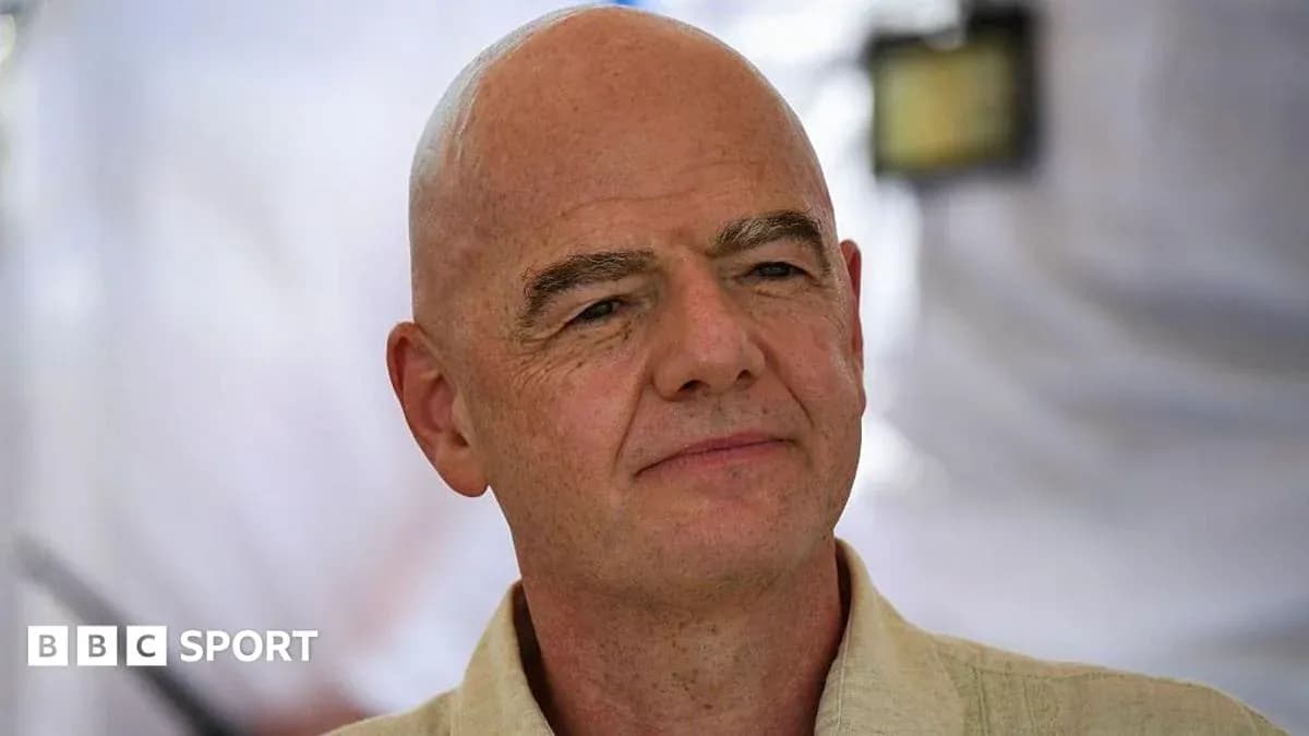 Man with a bald head speaking at an event Man with a bald head speaking at an event